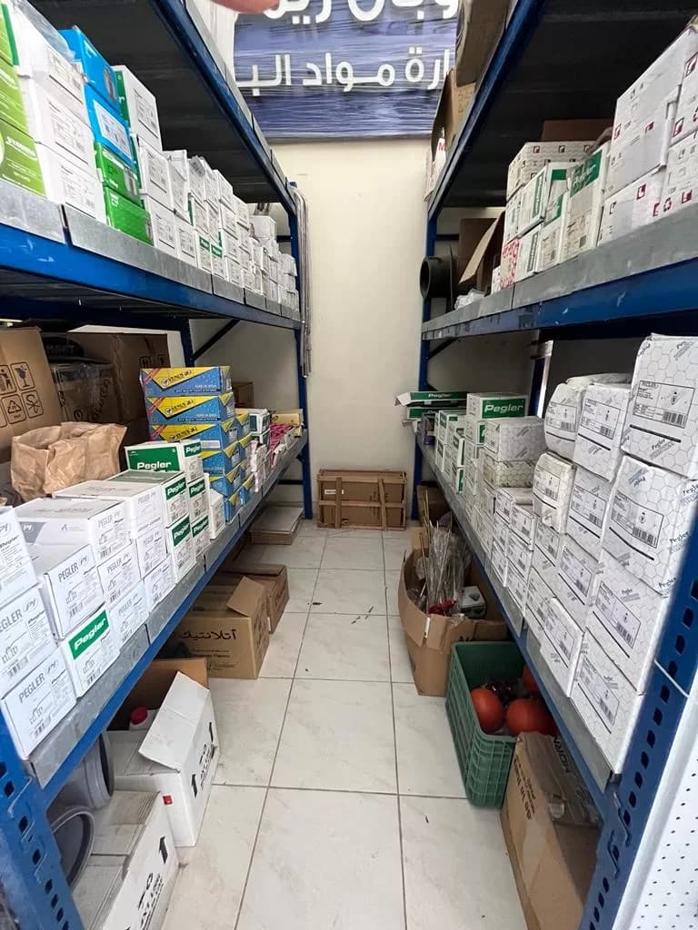 Pipes and fittings stacked for contractor supply in Musaffah